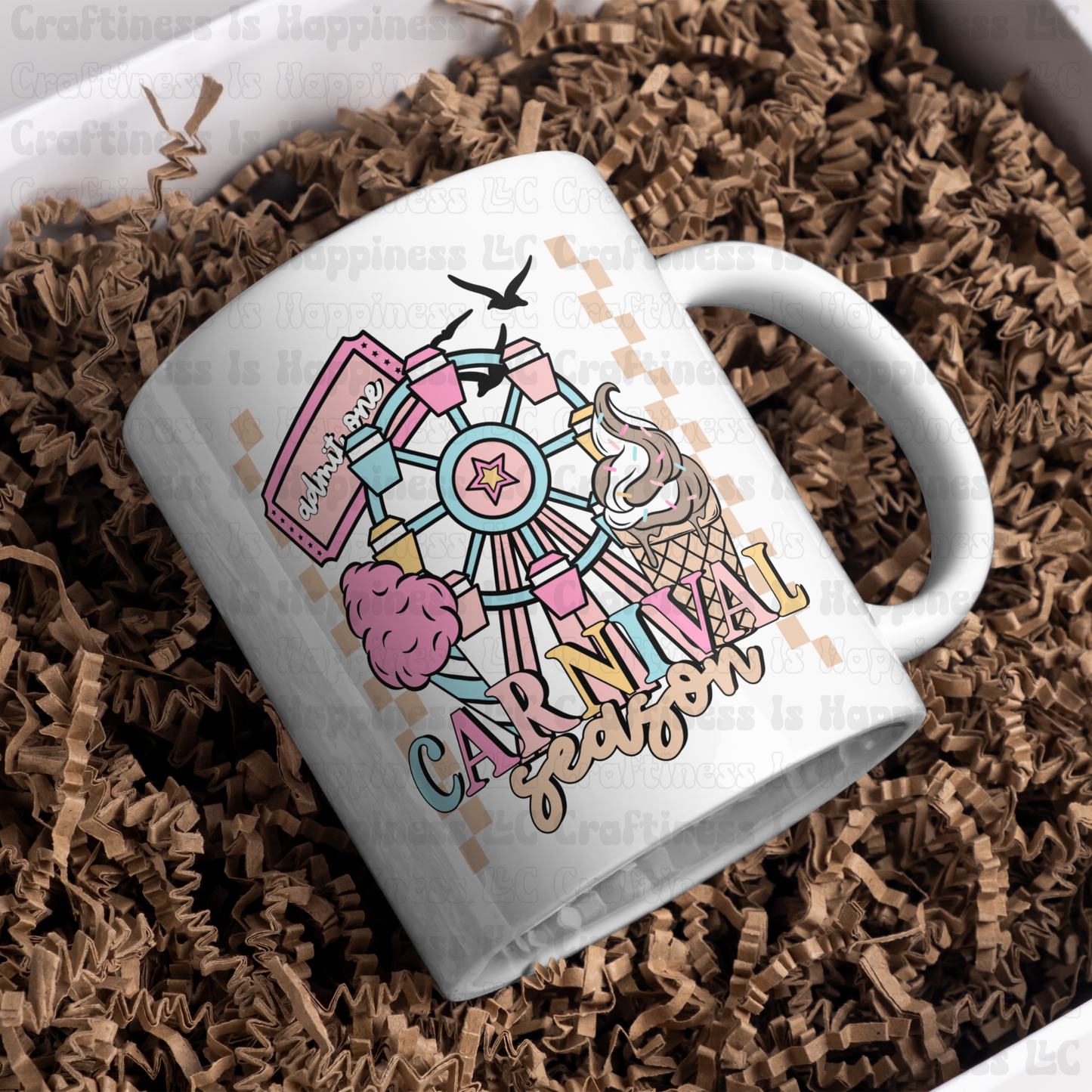 White mug with colorful 'Carnival Season' design on a bed of brown paper shreds
