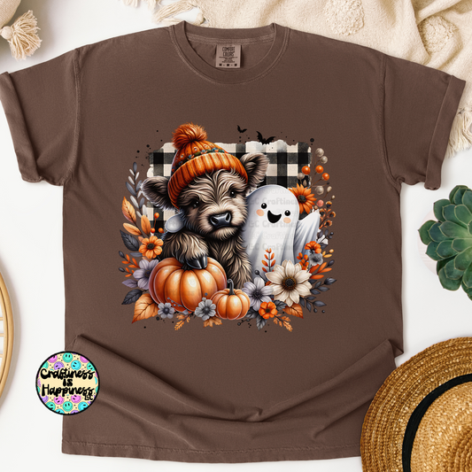 Brown t-shirt with a graphic of a bear, ghost, and pumpkins on a white background