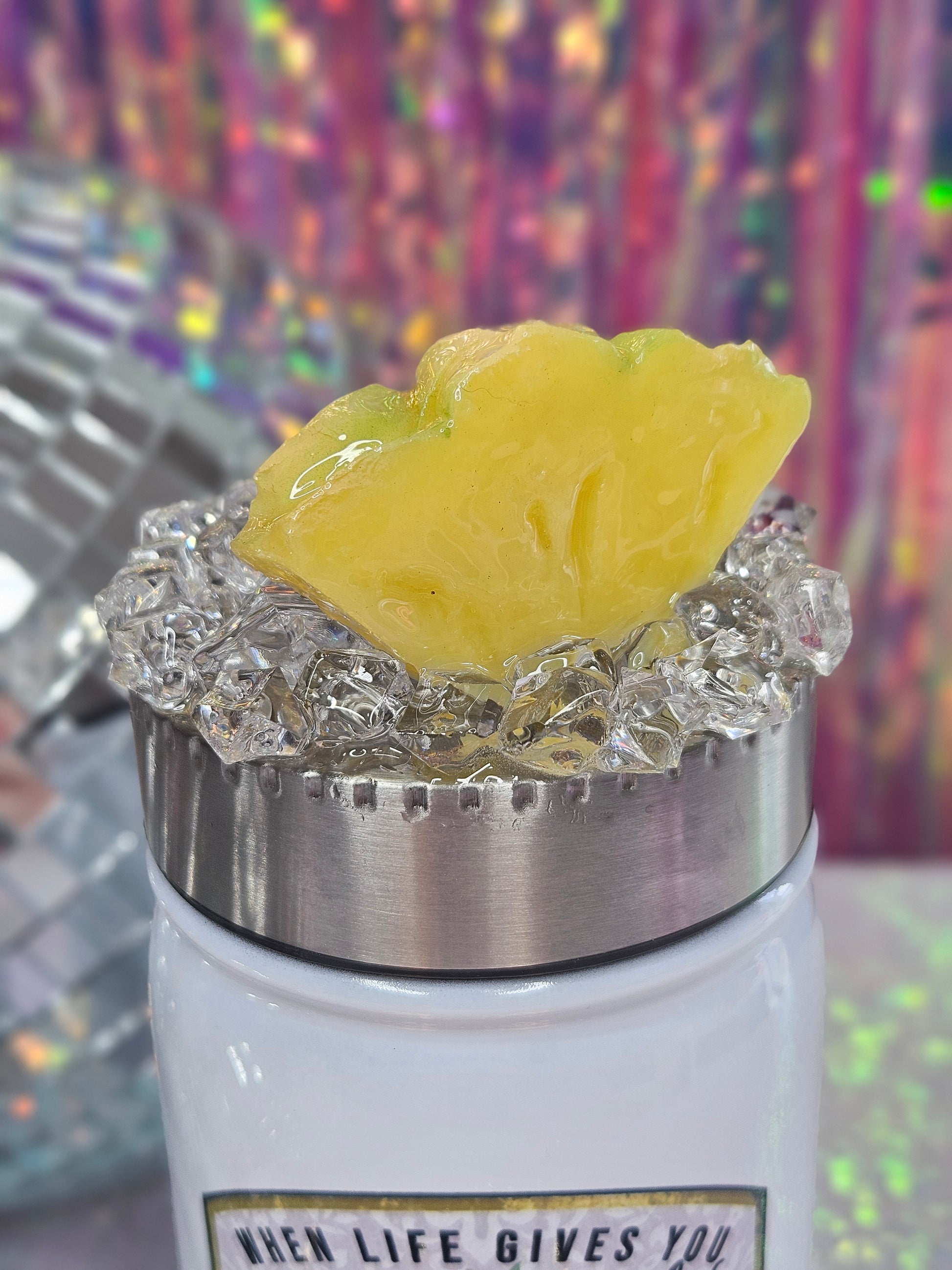 Stainless Steel screw on topper, decorated with faux ice and a slice of pineapple. It is sealed with epoxy. 