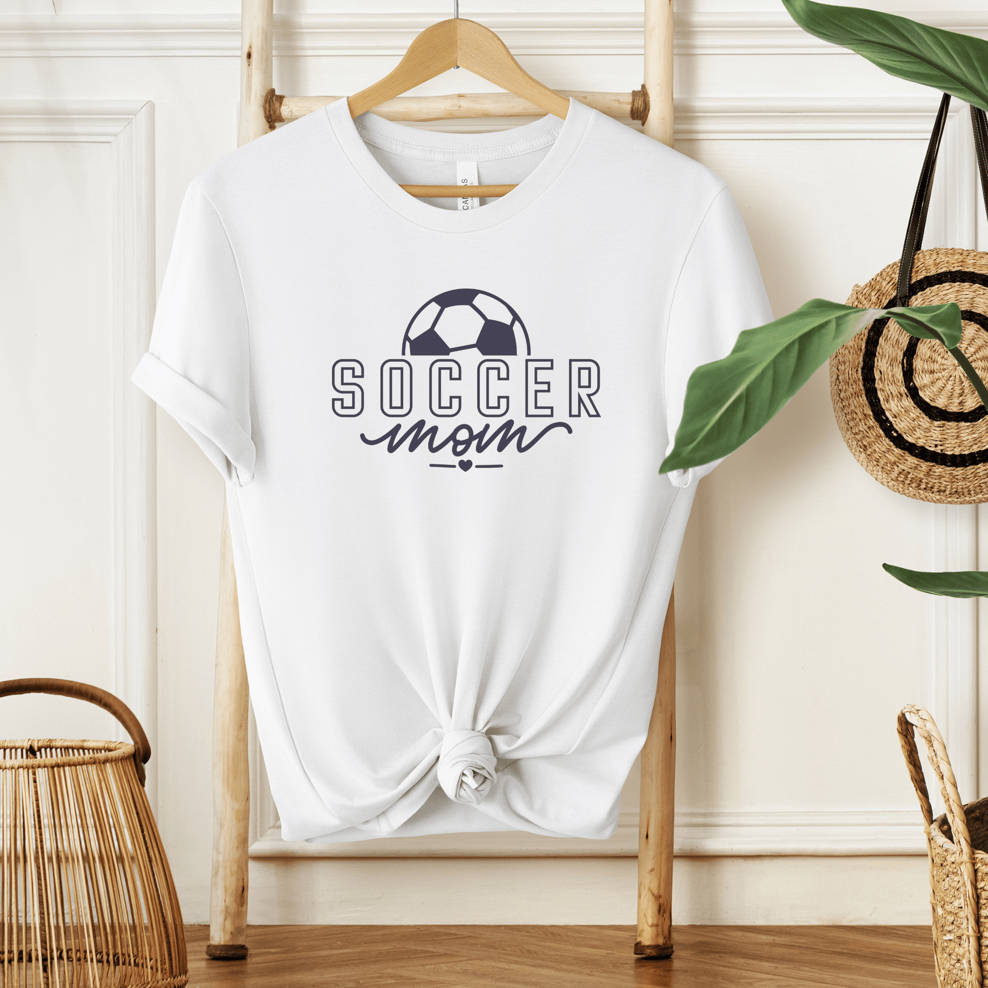 white short sleeve tee with "Soccer Mom" saying and a soccer ball