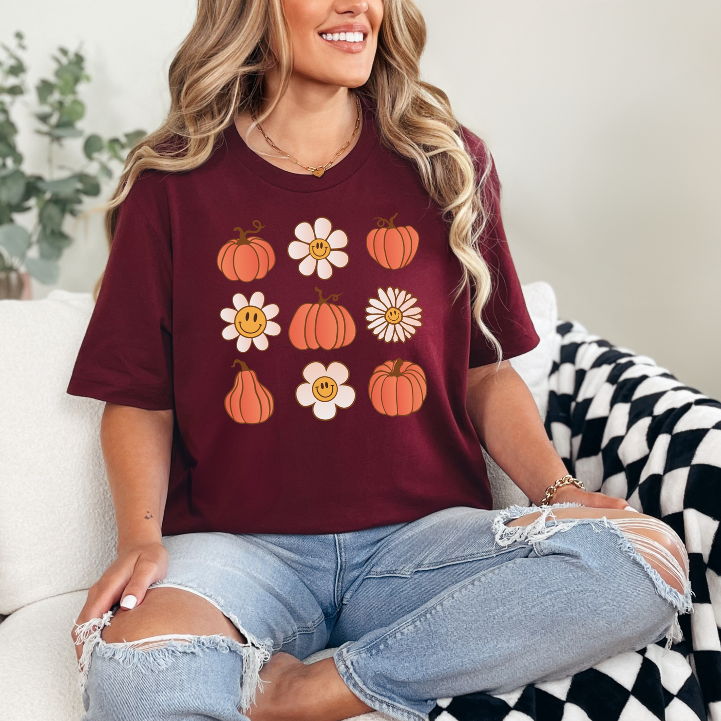 Burgundy short sleeve t-shirt with retro daisies and  pumpkins